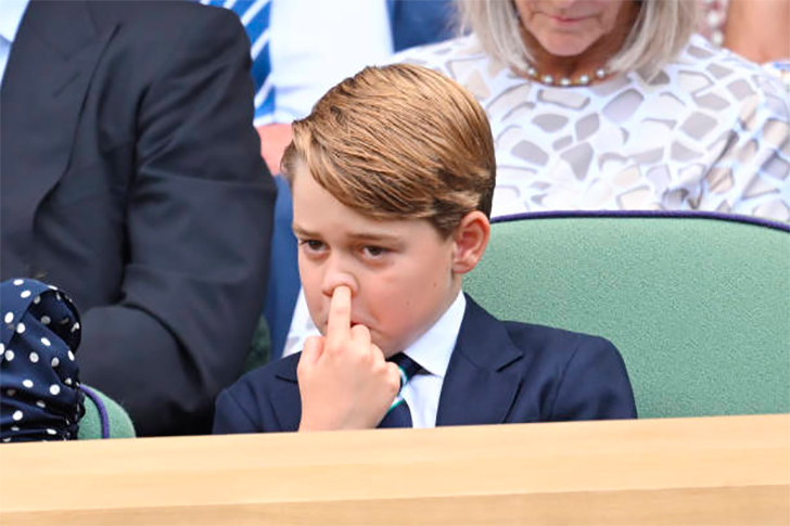 Prince George touches his nose