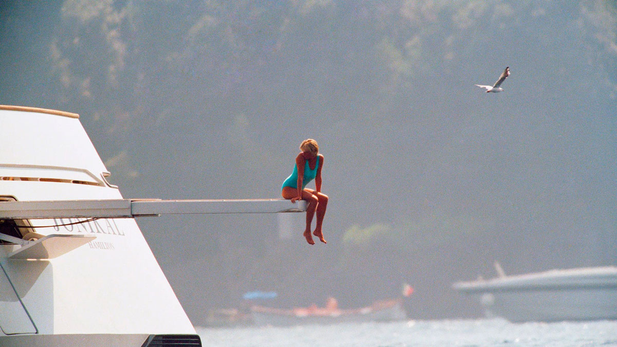Princess Diana sitting on diving board