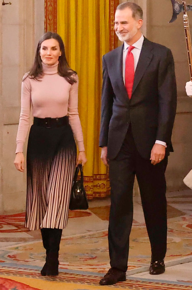 Queen Letizia wears a pleated skirt