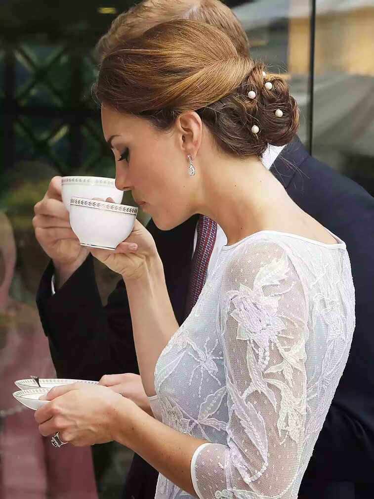 Kate Middleton's Hairstyles: Discover the Royal Inspiration Behind Them Kate Middleton Hairstyle - Braided Low Bun Adorned with Pearls
