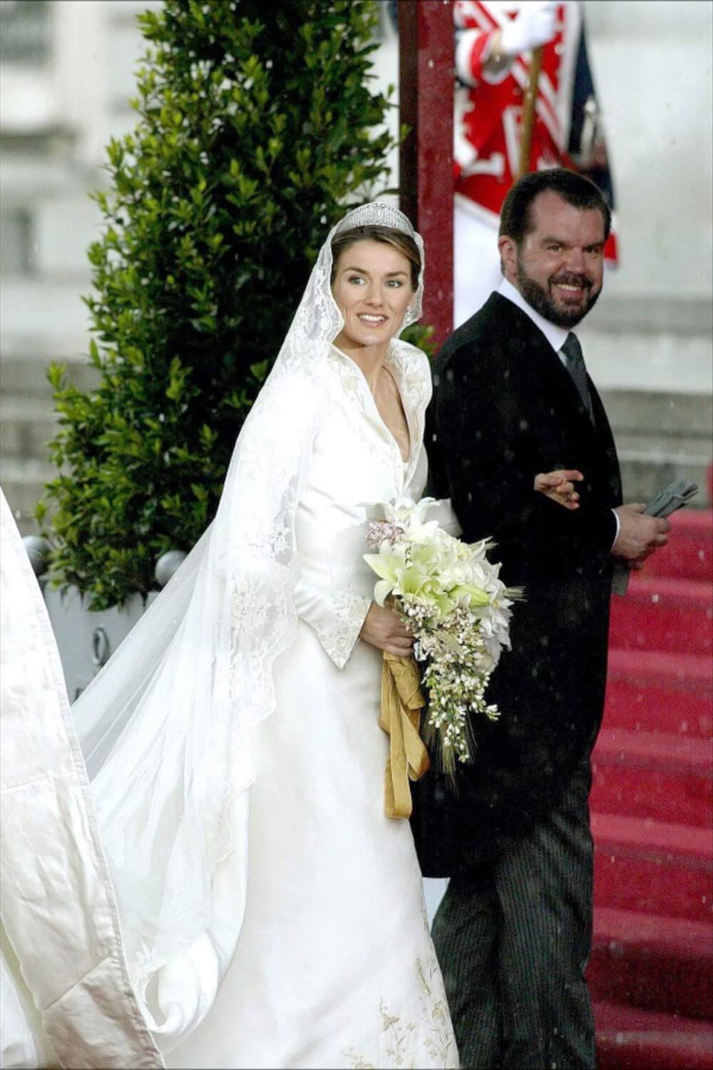 Queen Letizia walking down the aisle in a magnificent wedding gown