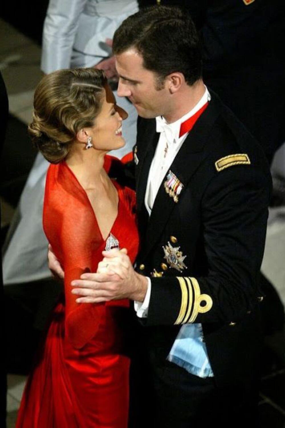 The royal couple dancing gracefully at a ball