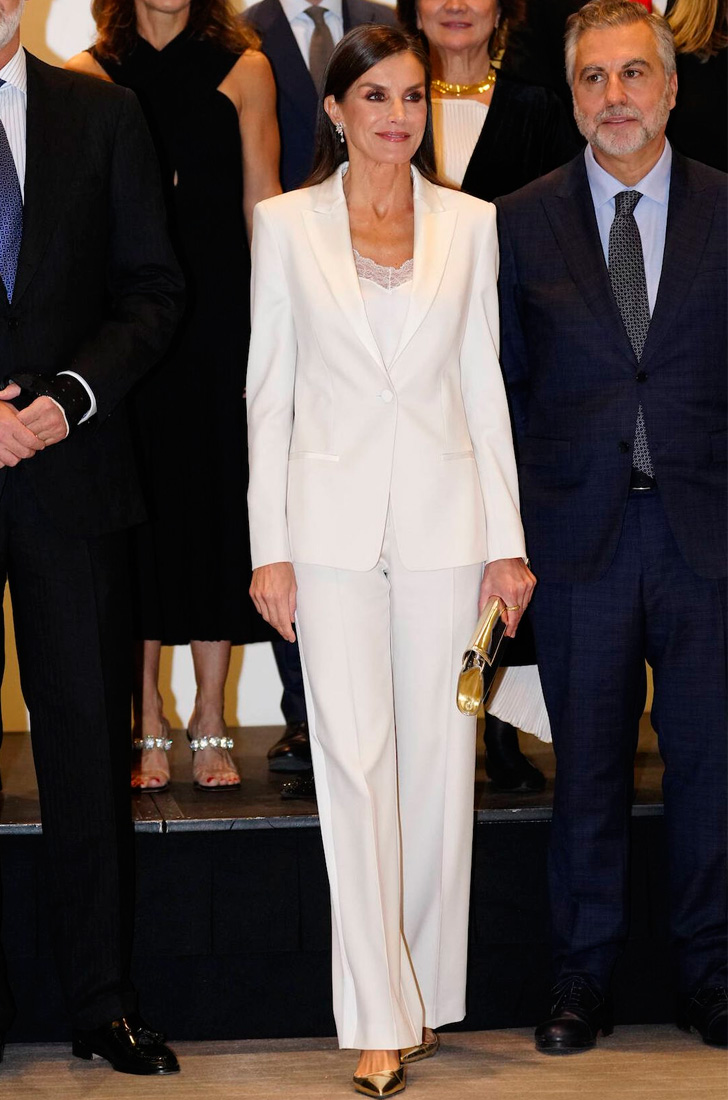 Queen Letizia in a white pantsuit by Hugo Boss