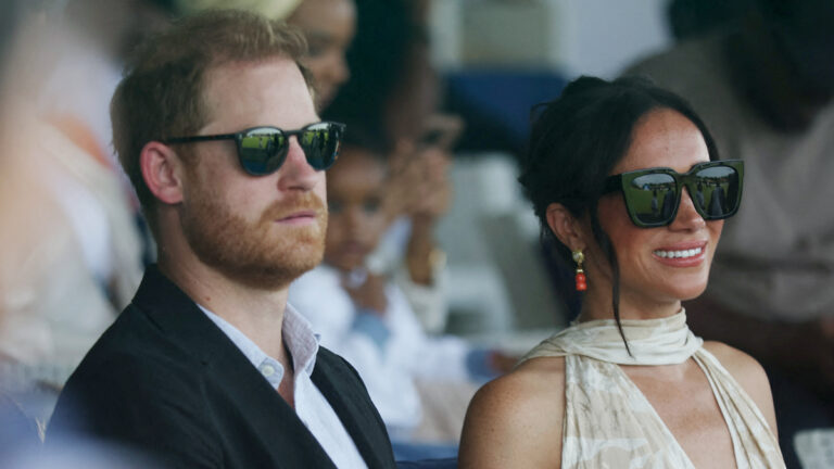 Were Harry and Meghan photographed with a man wanted in the U.S. for fraud? Harry and Meghan's Nigeria Trip