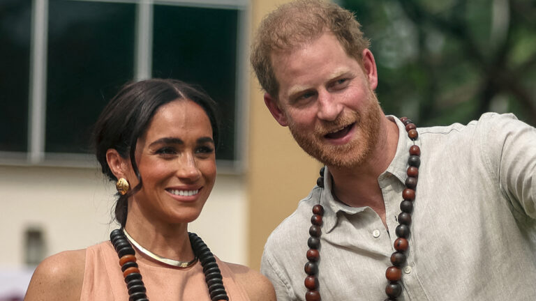 Harry & Meghan’s Nigeria visit: The Duchess wore a long dress with back neckline Prince Harry and Meghan Markle's Visit to Nigeria