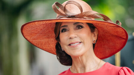 Queen Mary of Denmark in a coral dress by Andrew Gn
