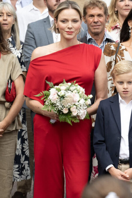 Princess Charlene in Asymmetrical Red Jumpsuit at the Principality Picnic