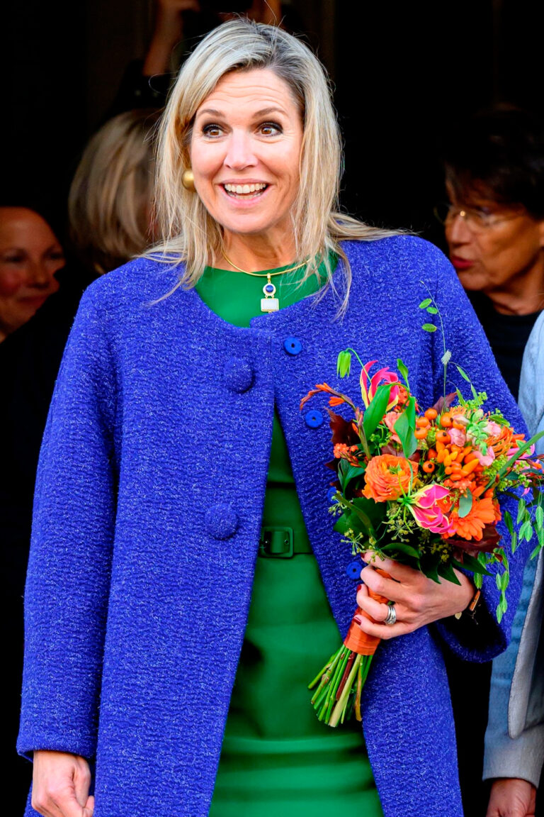 Queen Maxima Wears Natan Coat and Dior Tote During Her Visit to Dushi Huis in Waalwijk Queen Maxima in Green Dress and Blue Oversized Coat by Natan