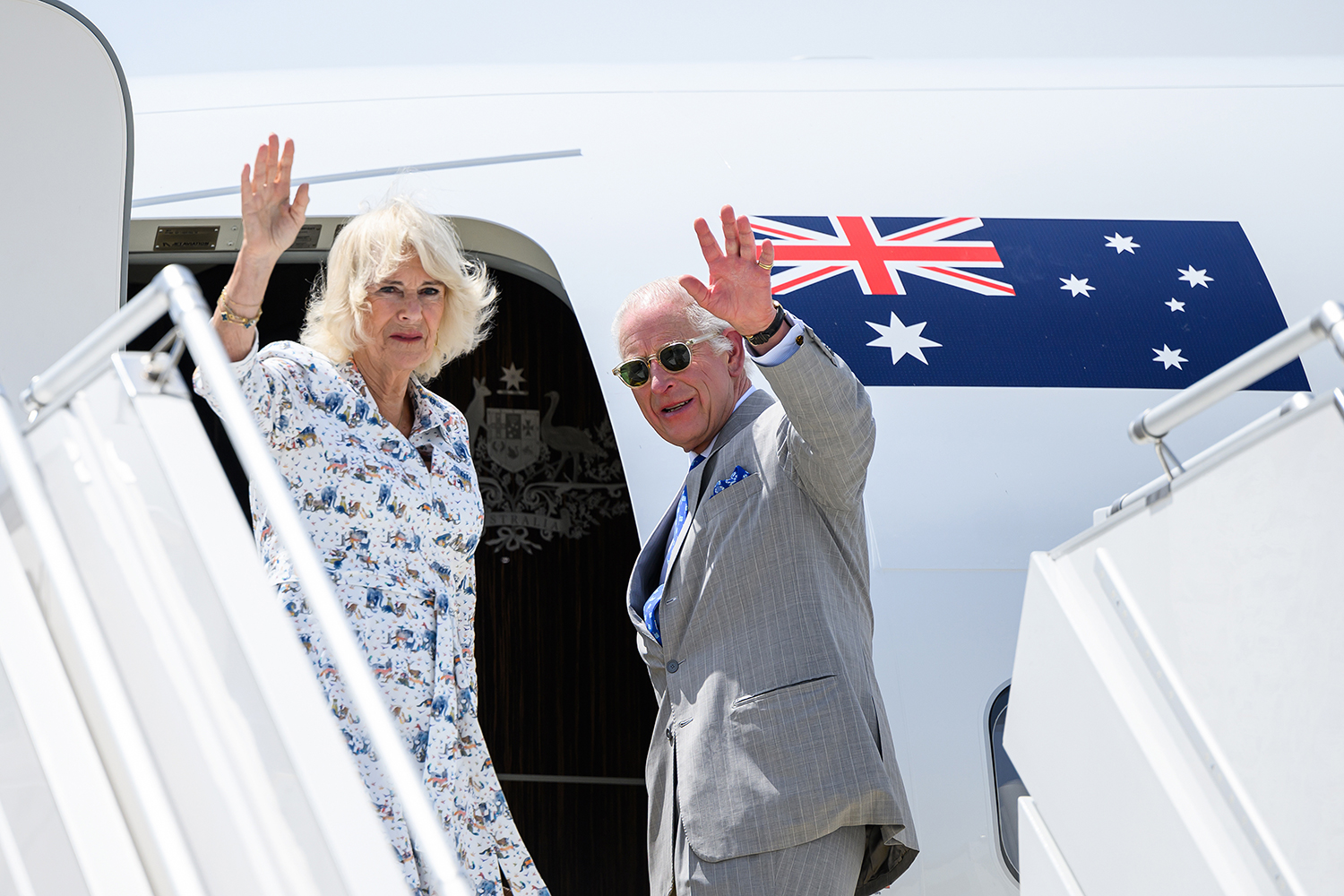 King Charles III and Queen Camilla wave during their official departure from Australia to fly to Samoa.