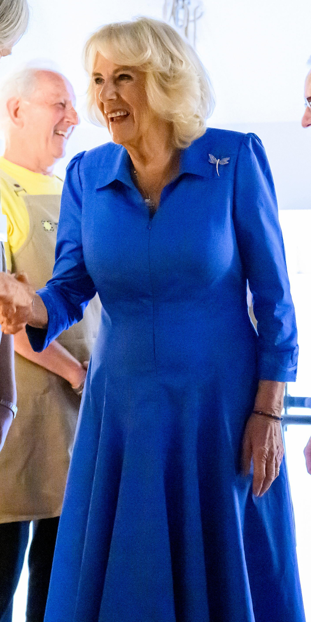 Queen Camilla wore blue again during a visit to the OzHarvest Refettorio in Sydney.