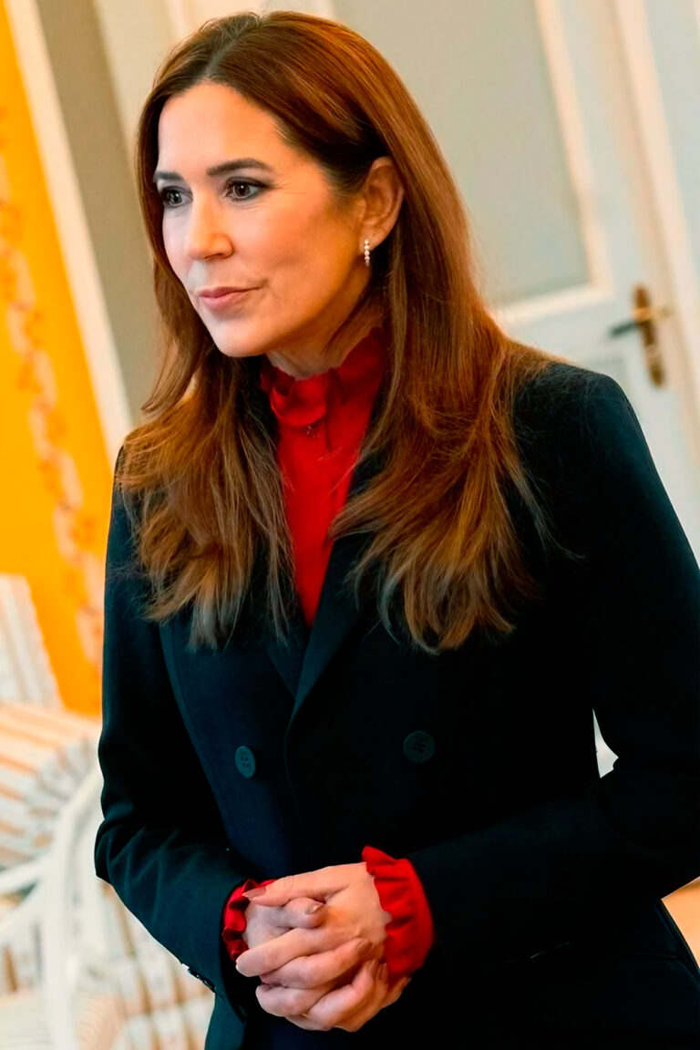 Queen Mary Stuns in Navy Suit and Red Blouse During Deaconess Foundation Visit Queen Mary in navy blue suit by The Fold and red blouse by Isabel Marant.