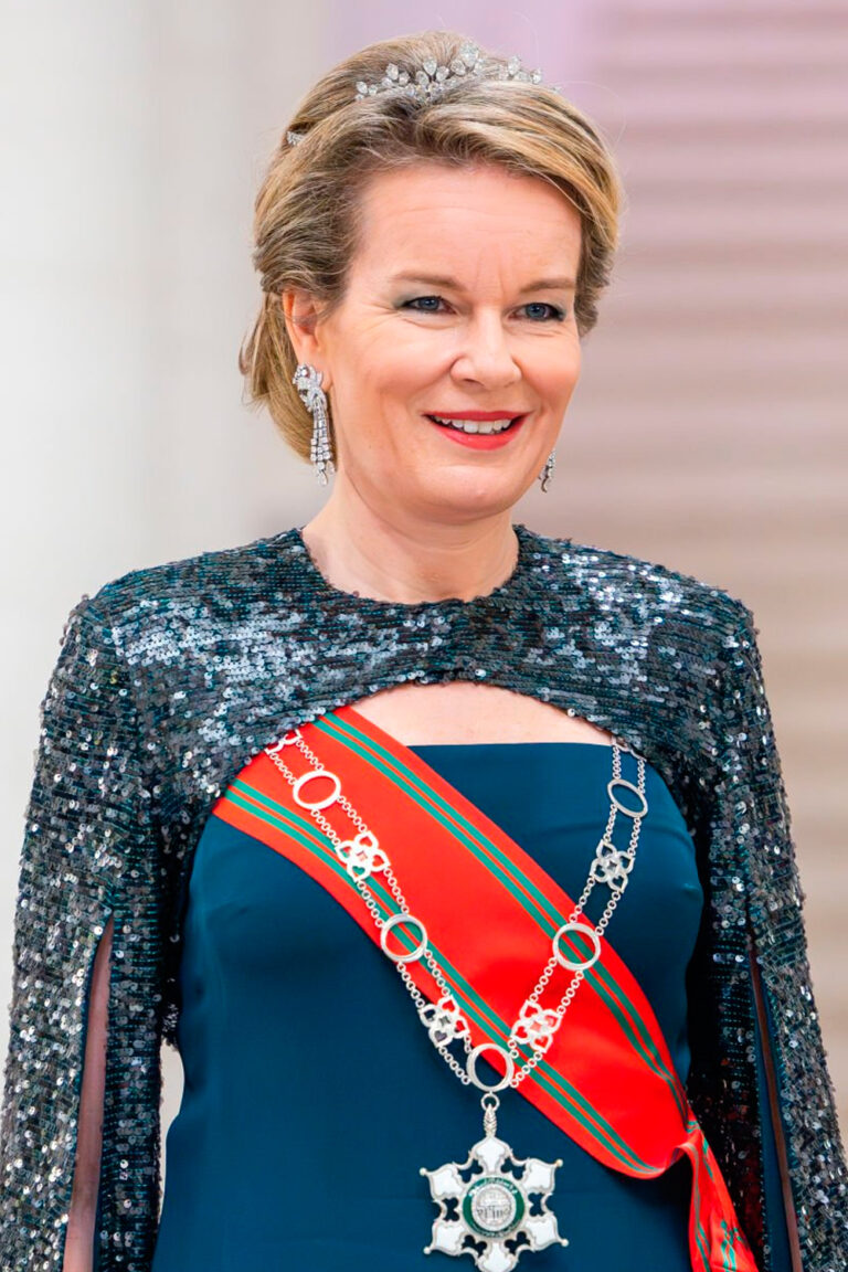 Queen Mathilde Stuns in Blue Cape Gown and Wolfers Tiara Queen Mathilde in Blue Cape Gown