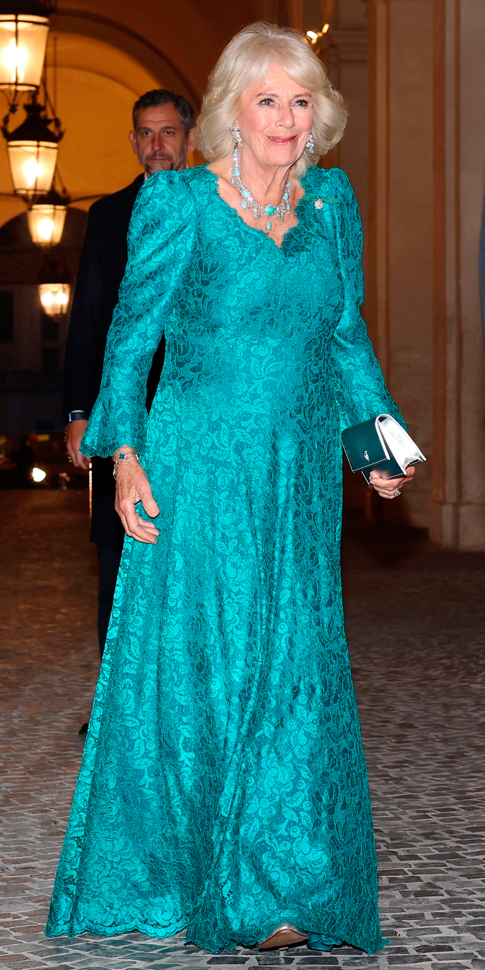 Queen Camilla wears a gown by Fiona Clare.