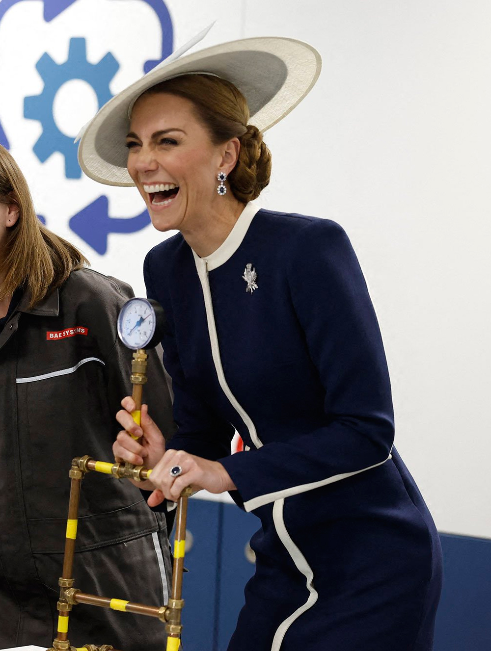 Kate wore a blue and white Philip Treacy headdress and earrings that belonged to Princess Diana.