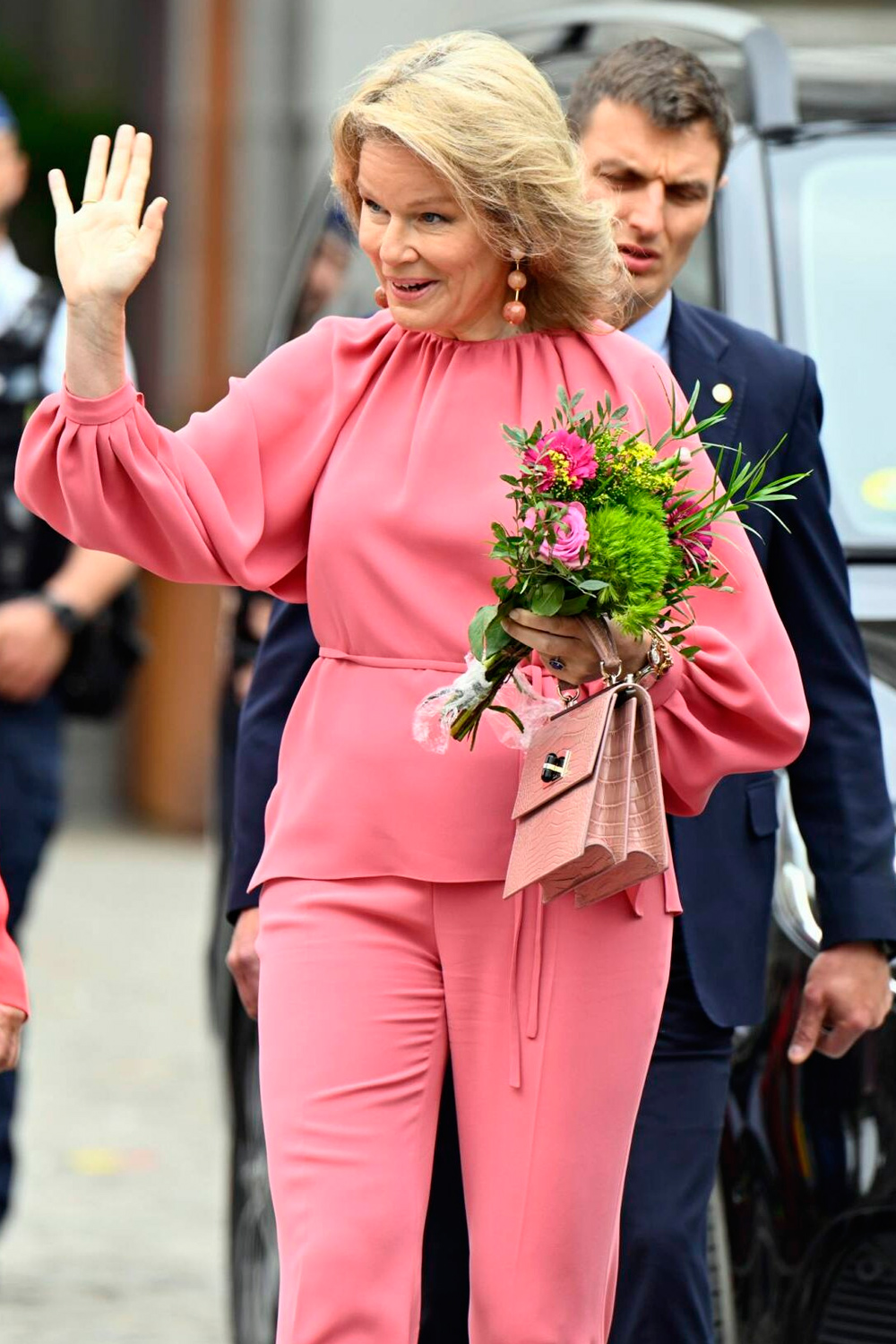 Queen Matilda wore a pink silk ensemble from the Natan firm