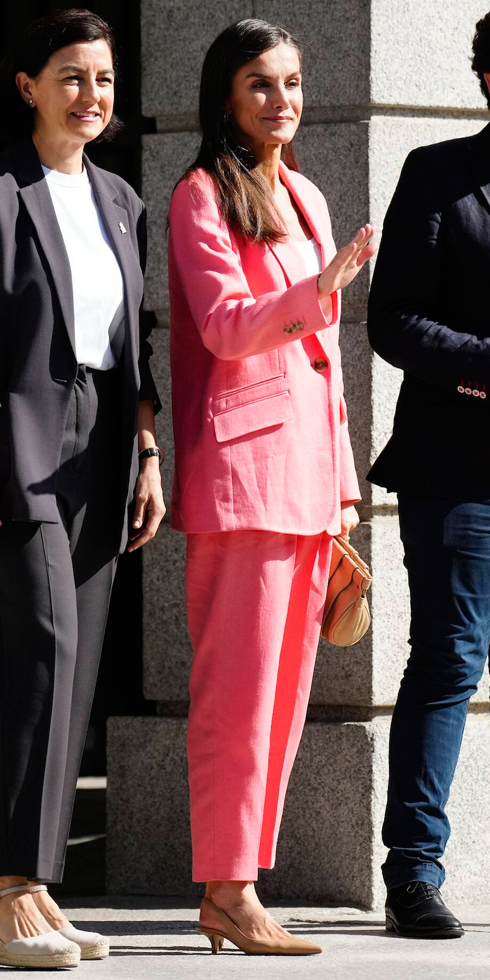 Queen Letizia wearing a coral suit by Hugo Boss