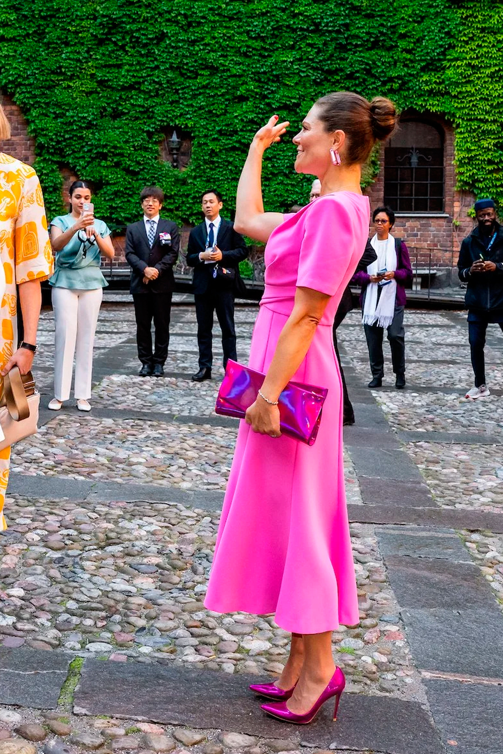 The Crown Princess paired her metallic heels with a matching clutch