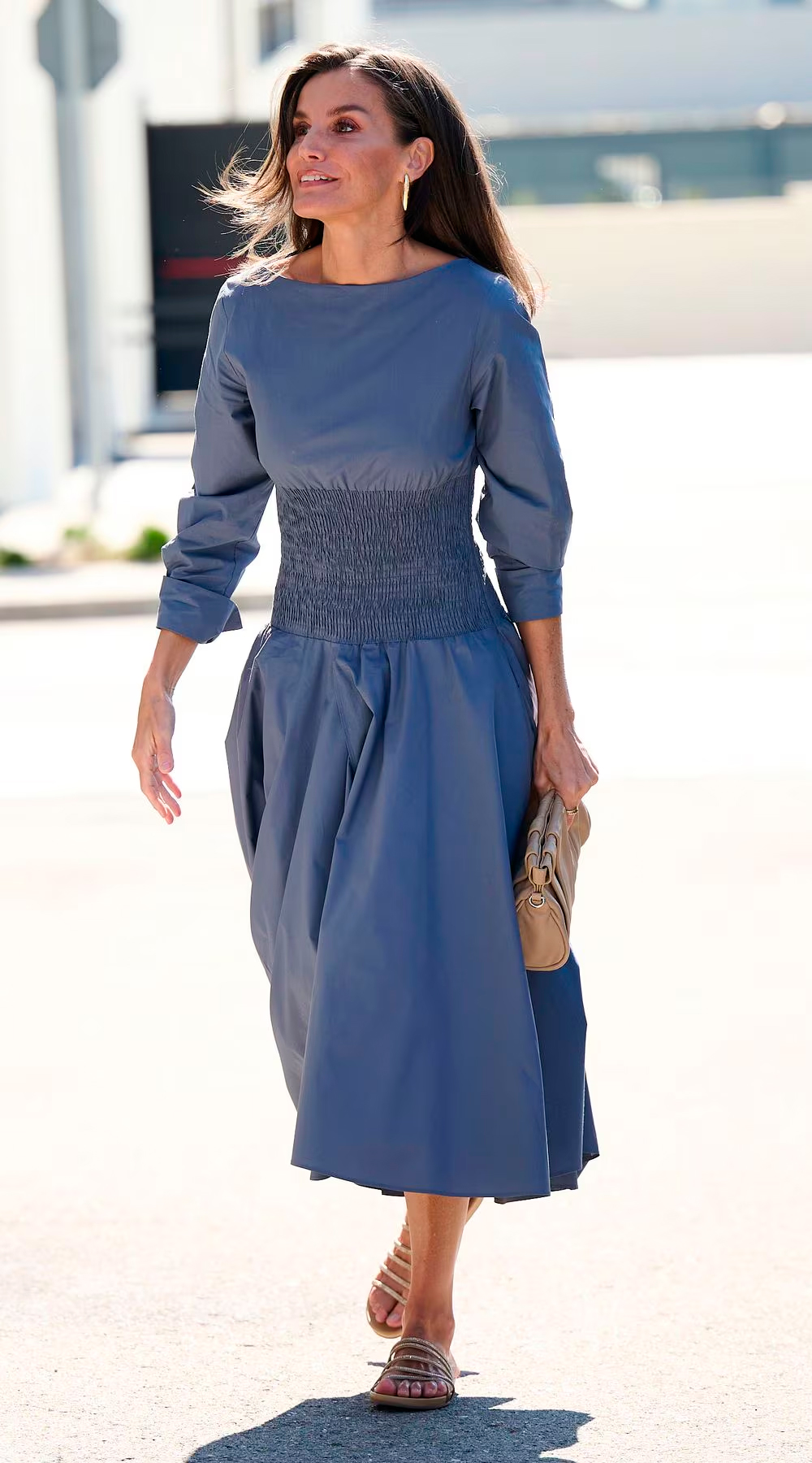 Queen Letizia wearing her metallic flat sandals.