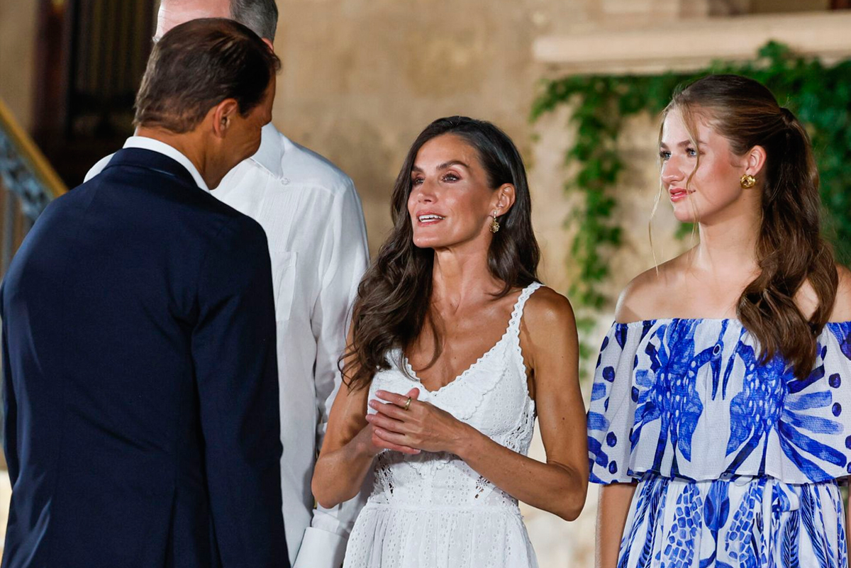 Queen Letizia conversing with tennis player Rafael Nadal.