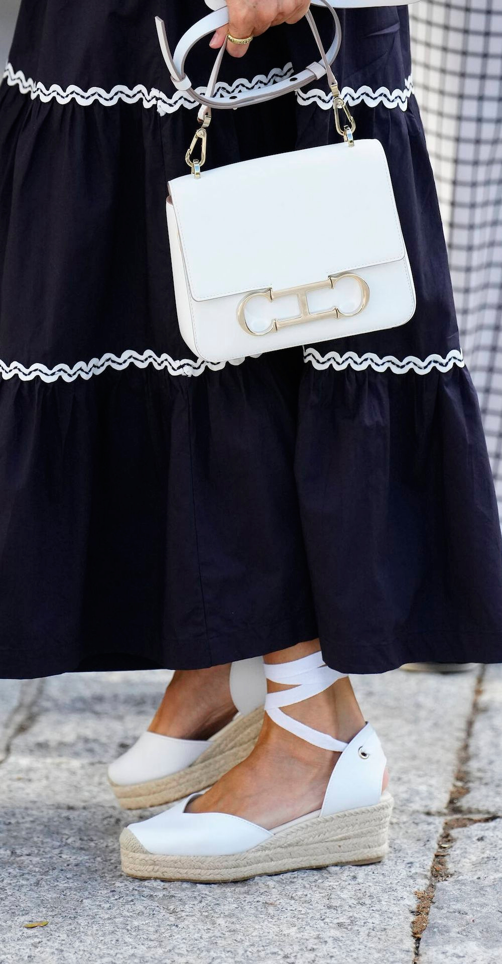 Detail of the Queen's espadrilles and bag.