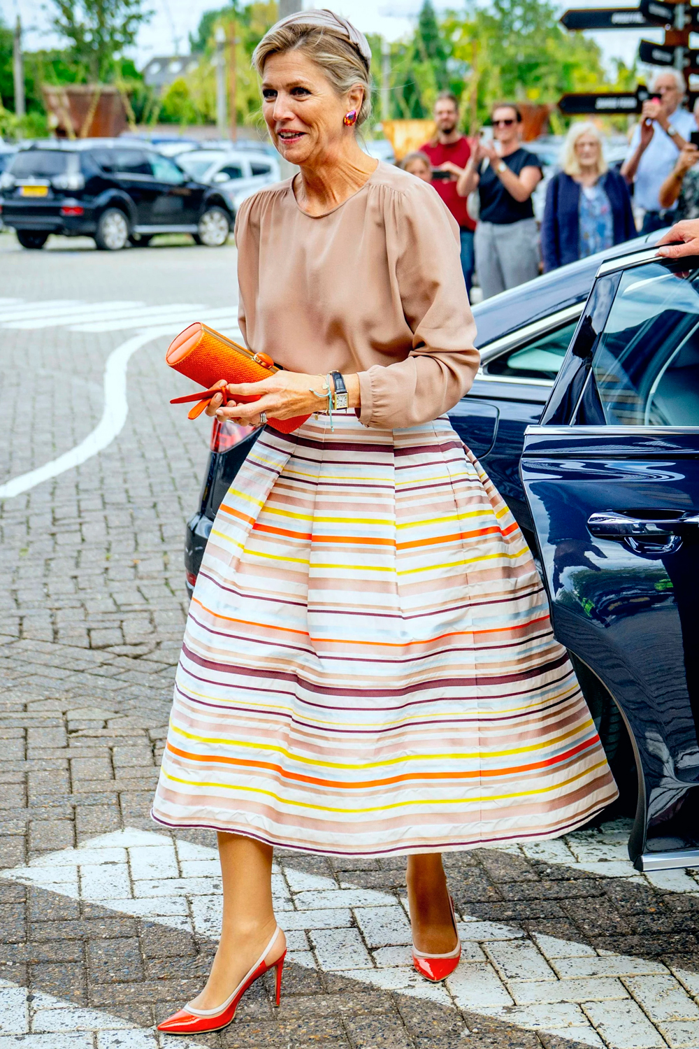  Queen Maxima wore a bold Natan Couture look with striped midi skirt
