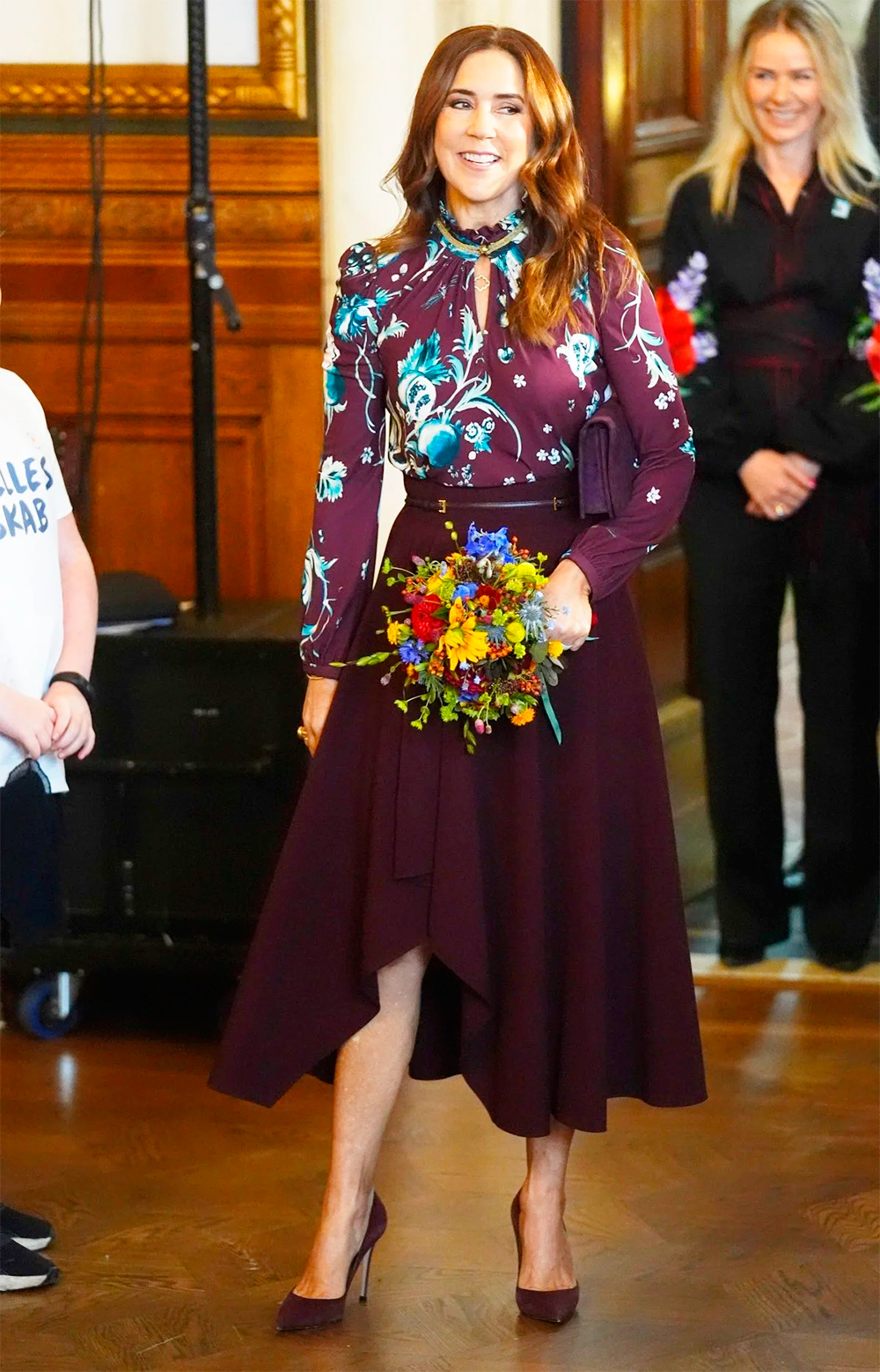 Mary wore a Roberto Cavalli blouse. 