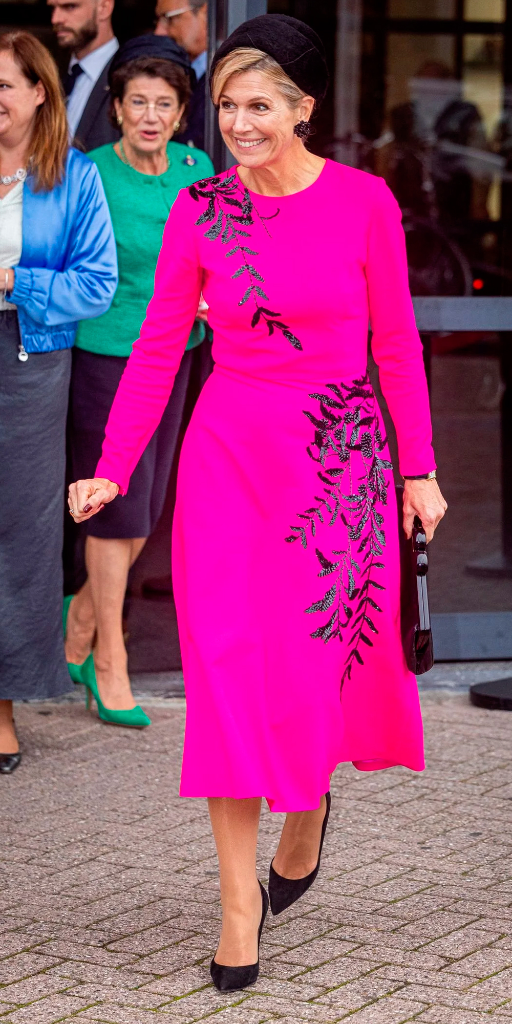 Maxima shows off her Oscar de la Renta dress.