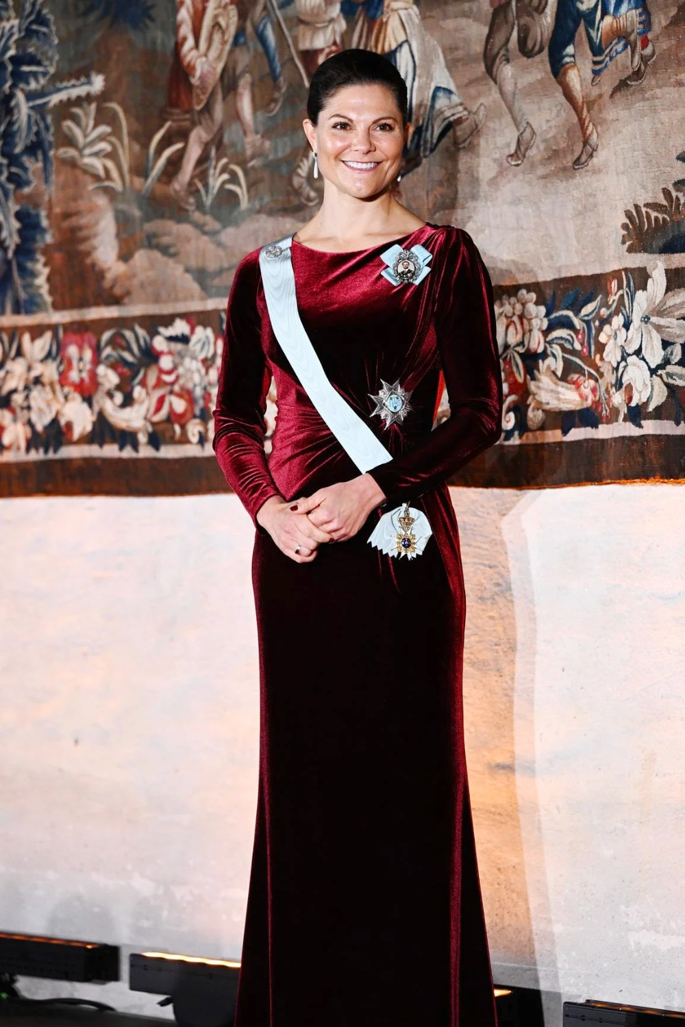 Princess Victoria wearing a stunning burgundy dress by Camilla Thulin.