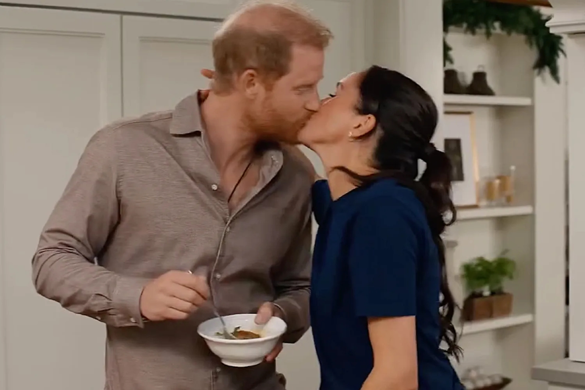 Harry and Meghan share a sweet kiss.