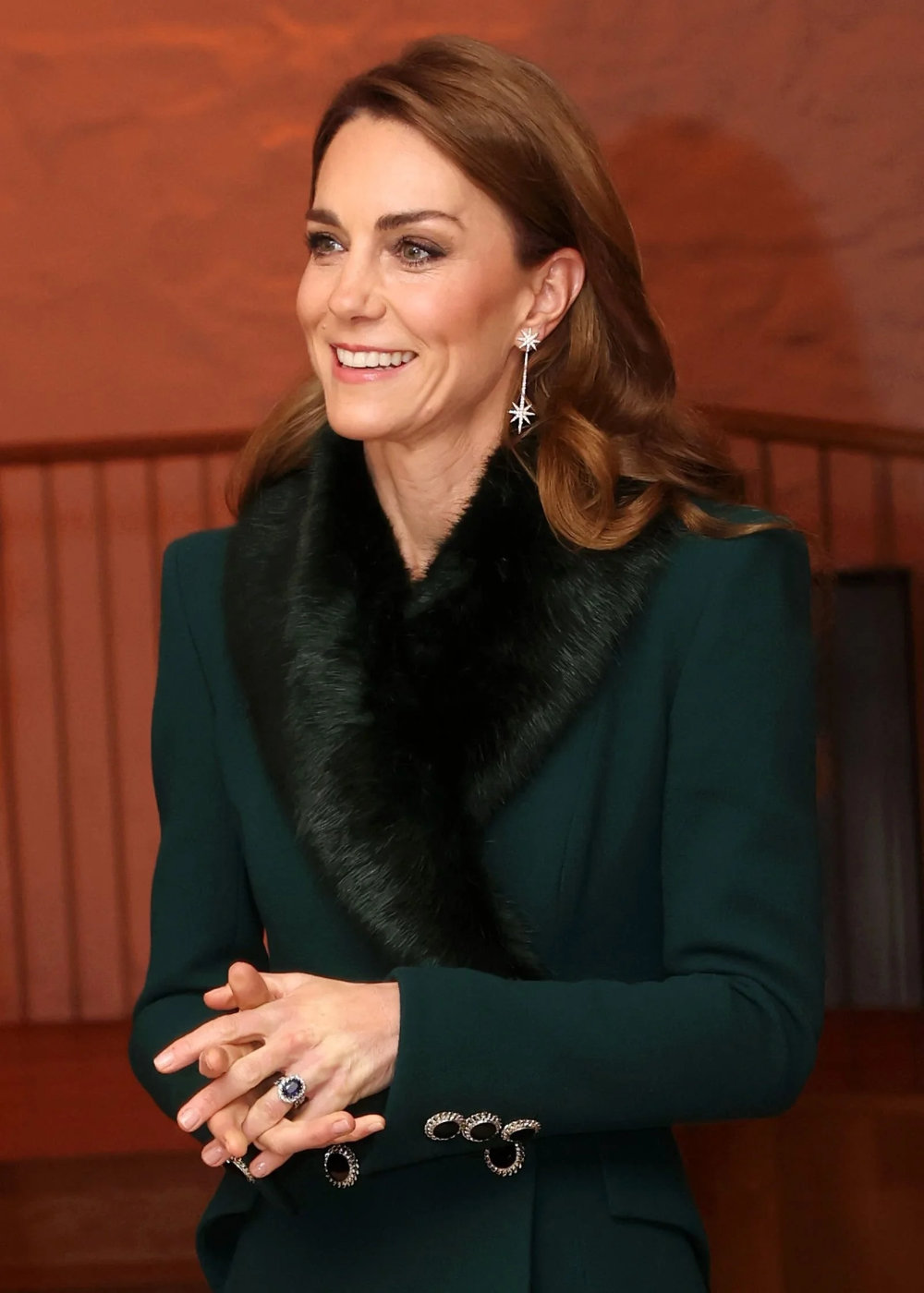 Kate is wearing some very Christmassy earrings.