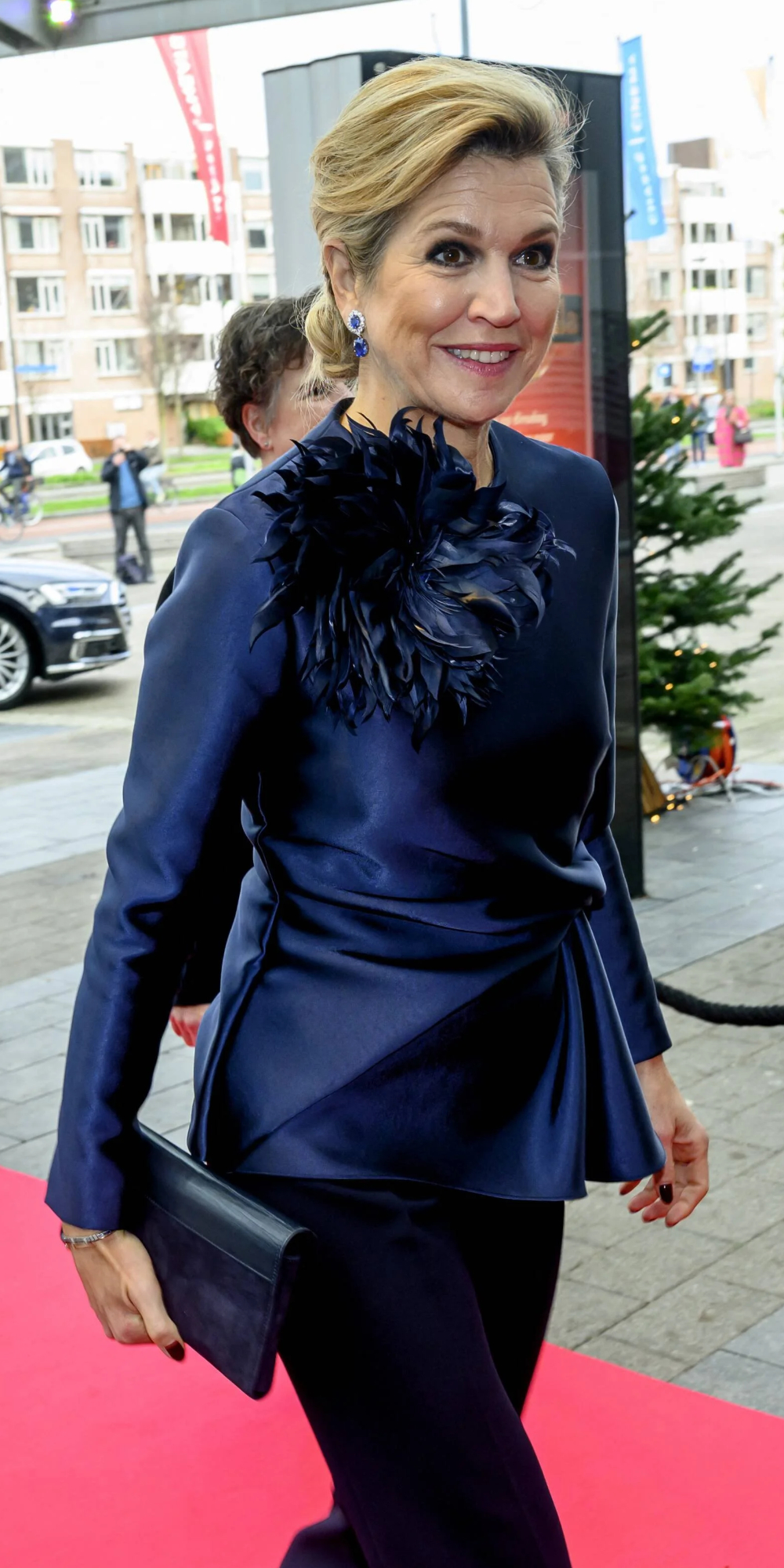 Queen Maxima Brings Festive Elegance to the Christmas Music Gala with a Refined Natan Ensemble Maxima chooses a navy satin Natan ensemble