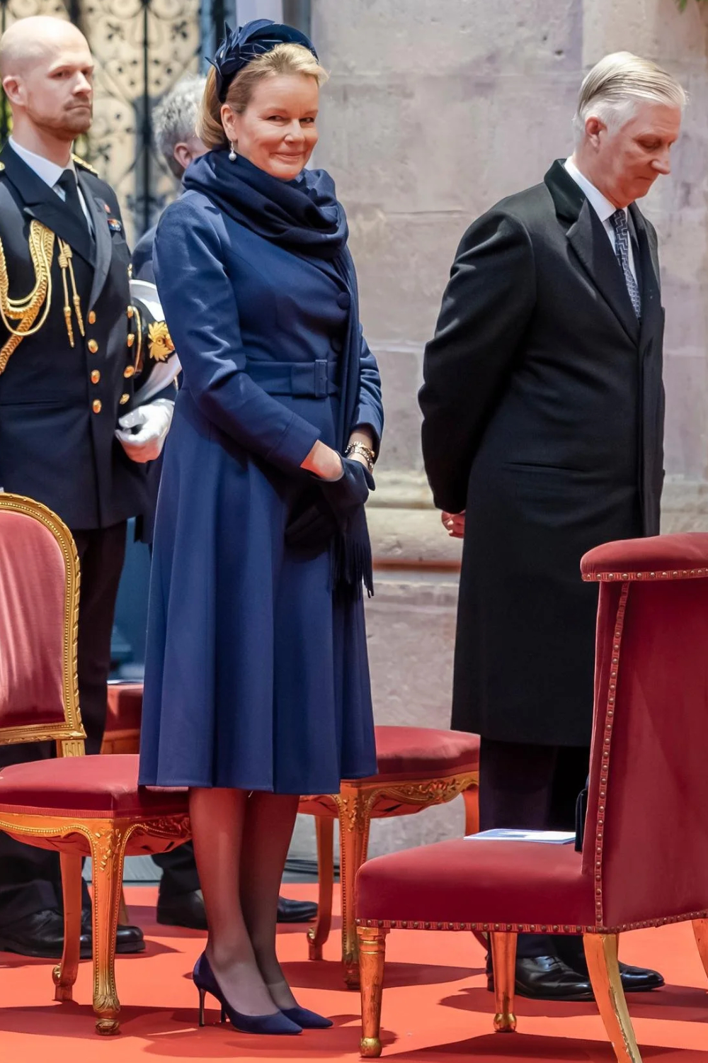 Queen Mathilde's Elegant Cathedral Look: Natan Dress and Meer Couture Coat Queen Mathilde wore a Meer Couture coat over a Natan dress