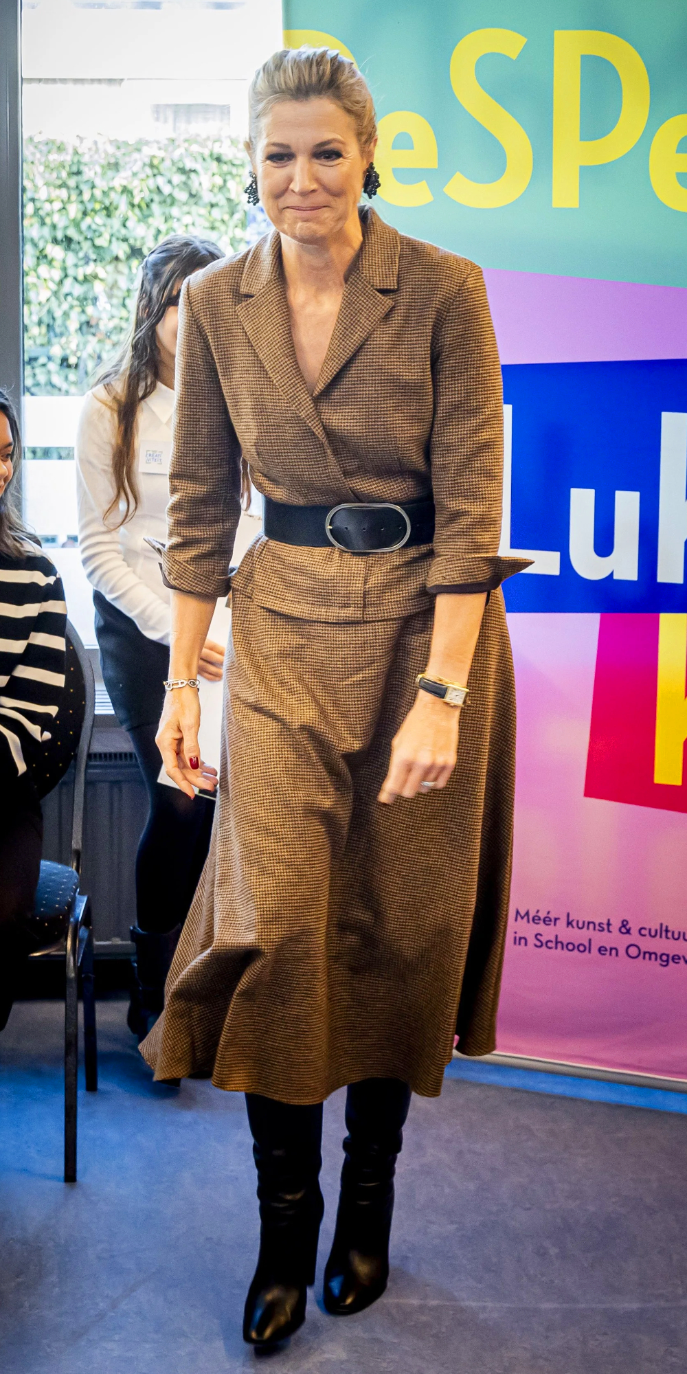 What did Queen Maxima Wear During her Visit to De Stromen School in Alphen? Queen Maxima wears an outfit by Natan Couture with Gianvito Rossi boots.