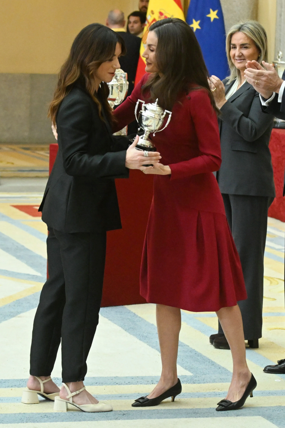 Queen Letizia Wears Burgundy Carolina Herrera to National Sports Awards 2026 Queen Letizia chose a burgundy Carolina Herrera midi dress for the National Sports Awards at El Pardo