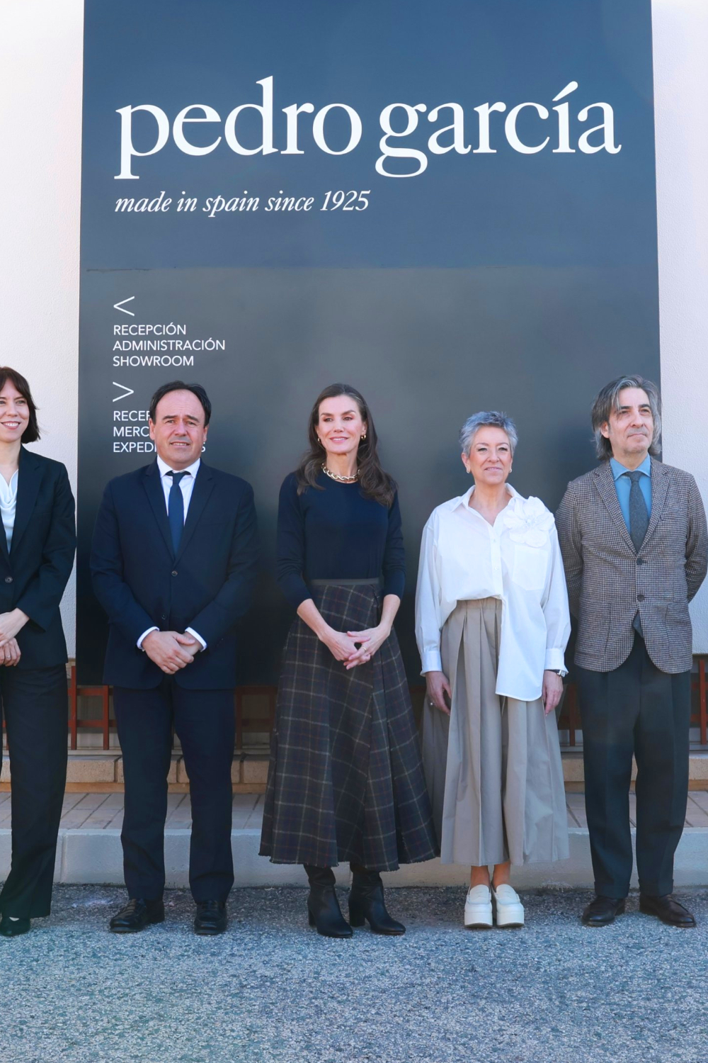 Queen Letizia Wears Bimba y Lola Plaid Skirt and Wide-Heel Boots in Elda Queen Letizia celebrated Spanish shoemaker Pedro García's 100th anniversary