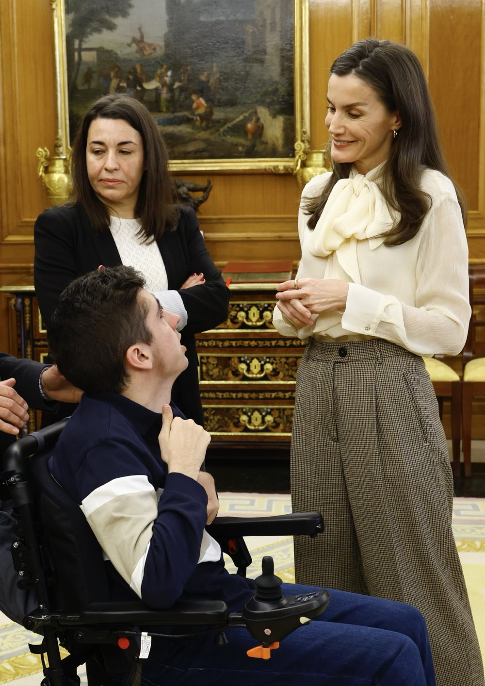 Queen Letizia's Look at Zarzuela: Lace-Up Blouse and Checked Trousers Queen Letizia during one of her audiences at La Zarzuela Palace.