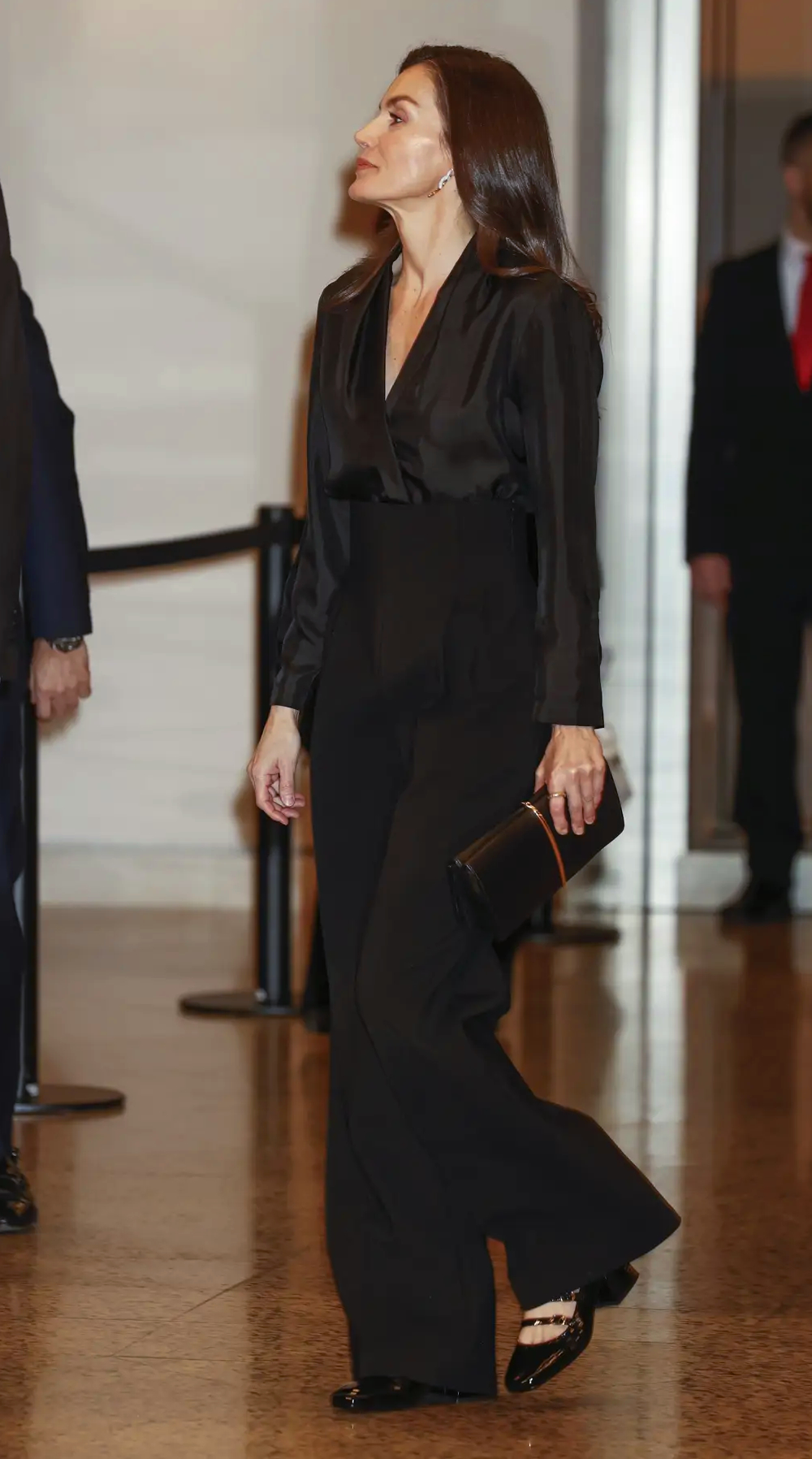 Queen Letizia's Black Outfit at the 2026 Terrorism Victims Concert Queen Letizia chose a Sandro wrap blouse and wide-leg pants