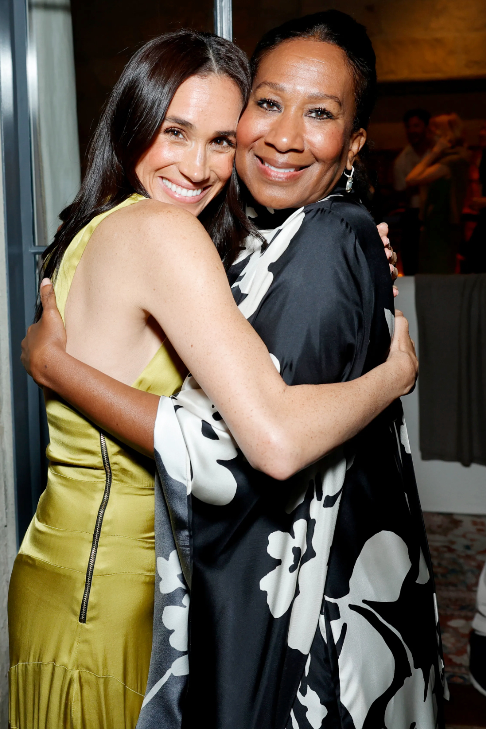 Meghan Markle Wore a Chartreuse Heidi Merrick Dress to a Netflix Event Meghan Markle with Nicole Avant.