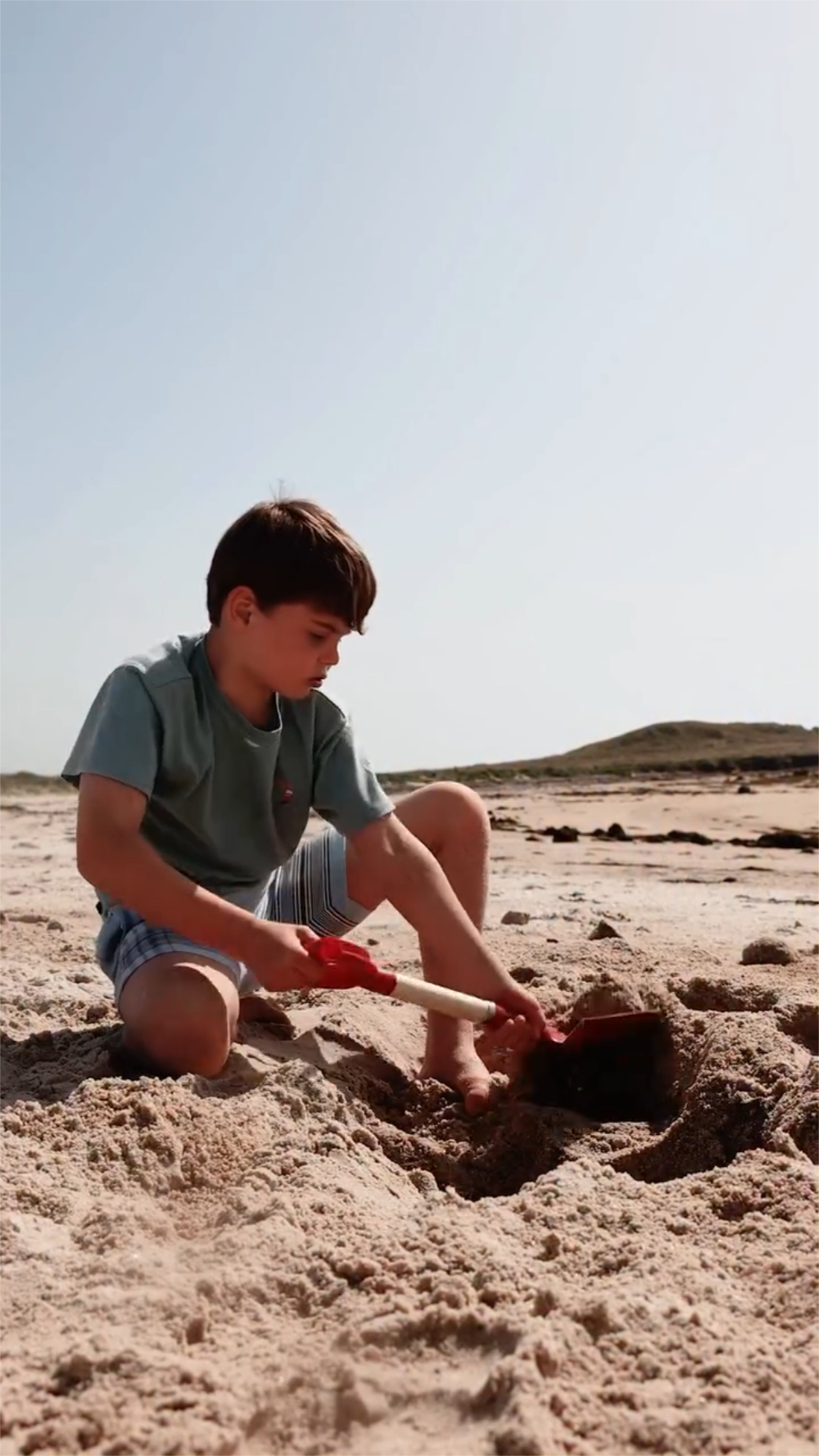 Behind the Scenes of Prince Louis’ New 8th Birthday Photo and Video Prince Louis playing in the sand during his vacation in Cornwall