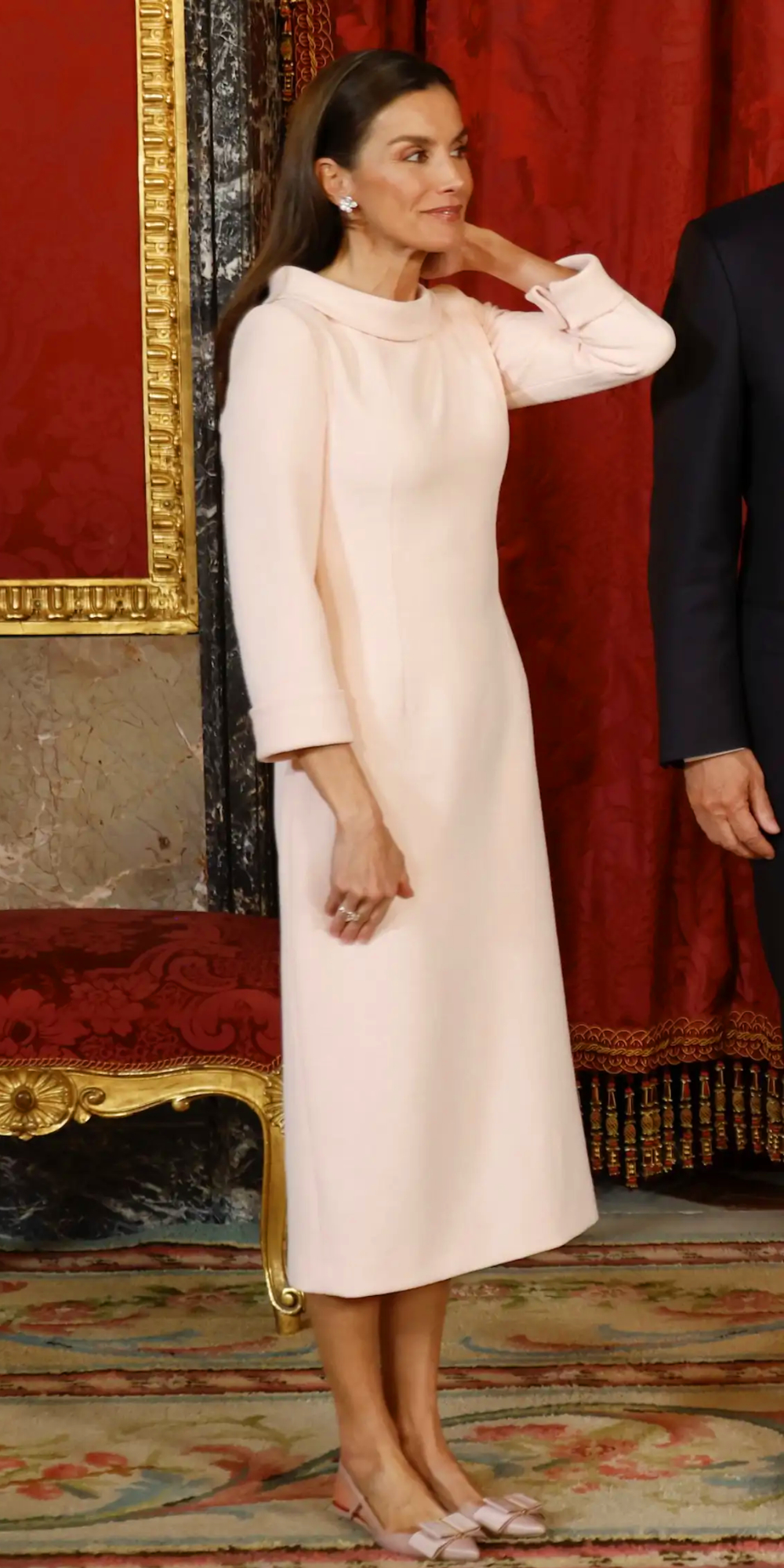 Queen Letizia Debuts a Macaron-Pink Dress and Carolina Herrera Pumps Queen Letizia debuted a macaron-pink crepe dress and Carolina Herrera slingbacks