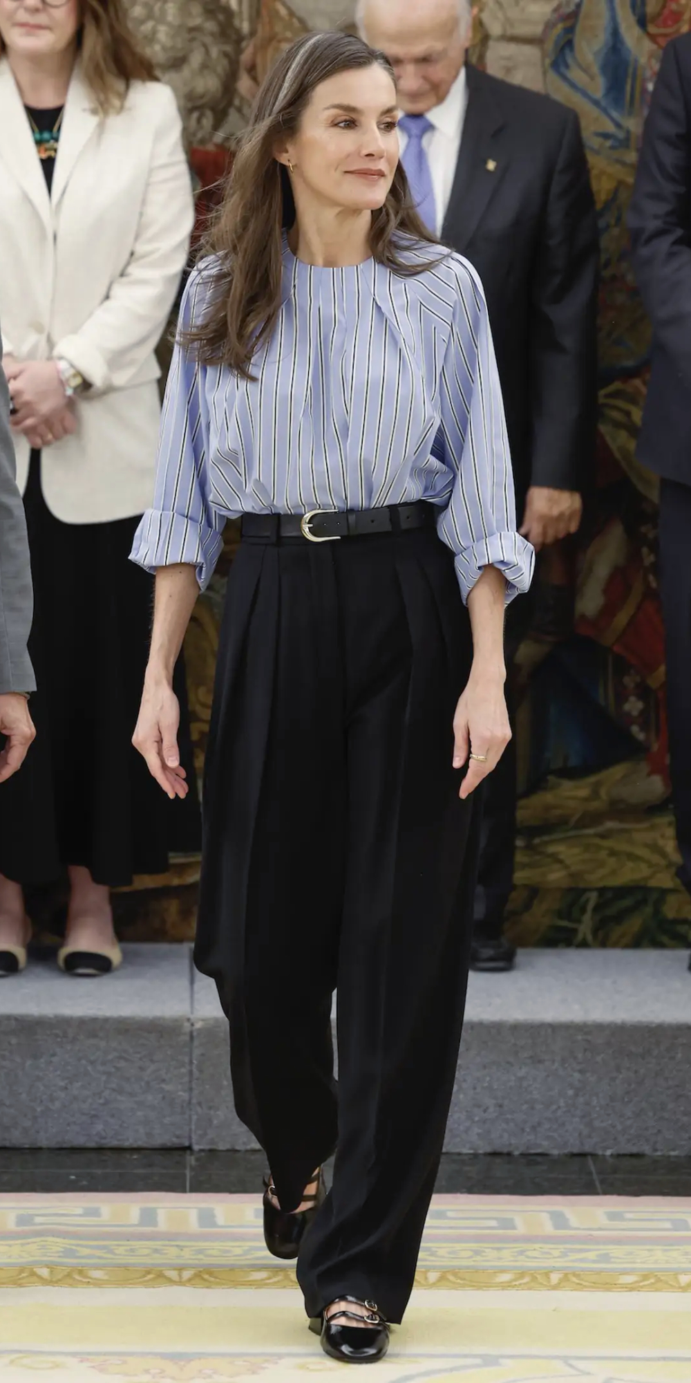 Queen Letizia Repeats Her Bestselling Adolfo Domínguez Blouse With a Styling Twist Queen Letizia's Blue Blouse & Palazzo Pants Look