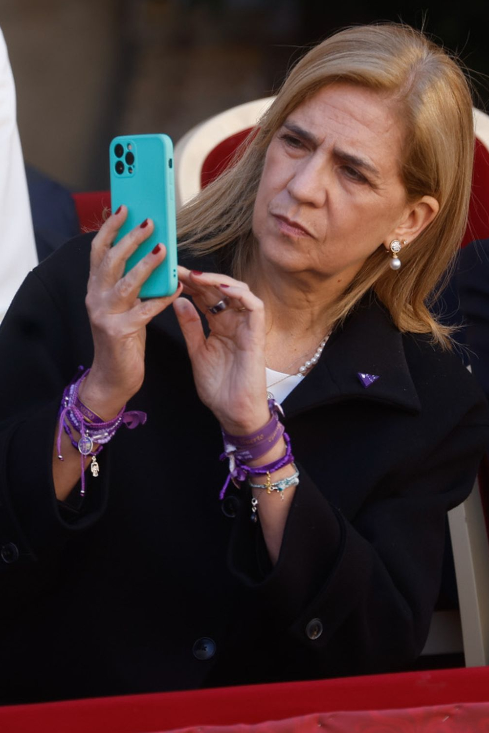 Queen Sofia and Her Daughters Elena and Cristina Spent Holy Week in Murcia Infanta Cristina taking photos.