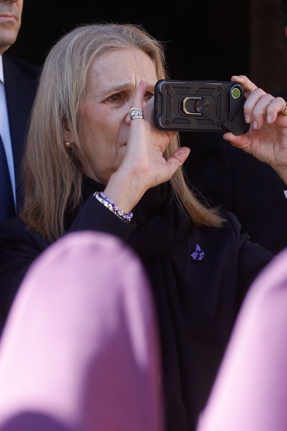 Queen Sofia and Her Daughters Elena and Cristina Spent Holy Week in Murcia Infanta Elena recording with her smartphone.