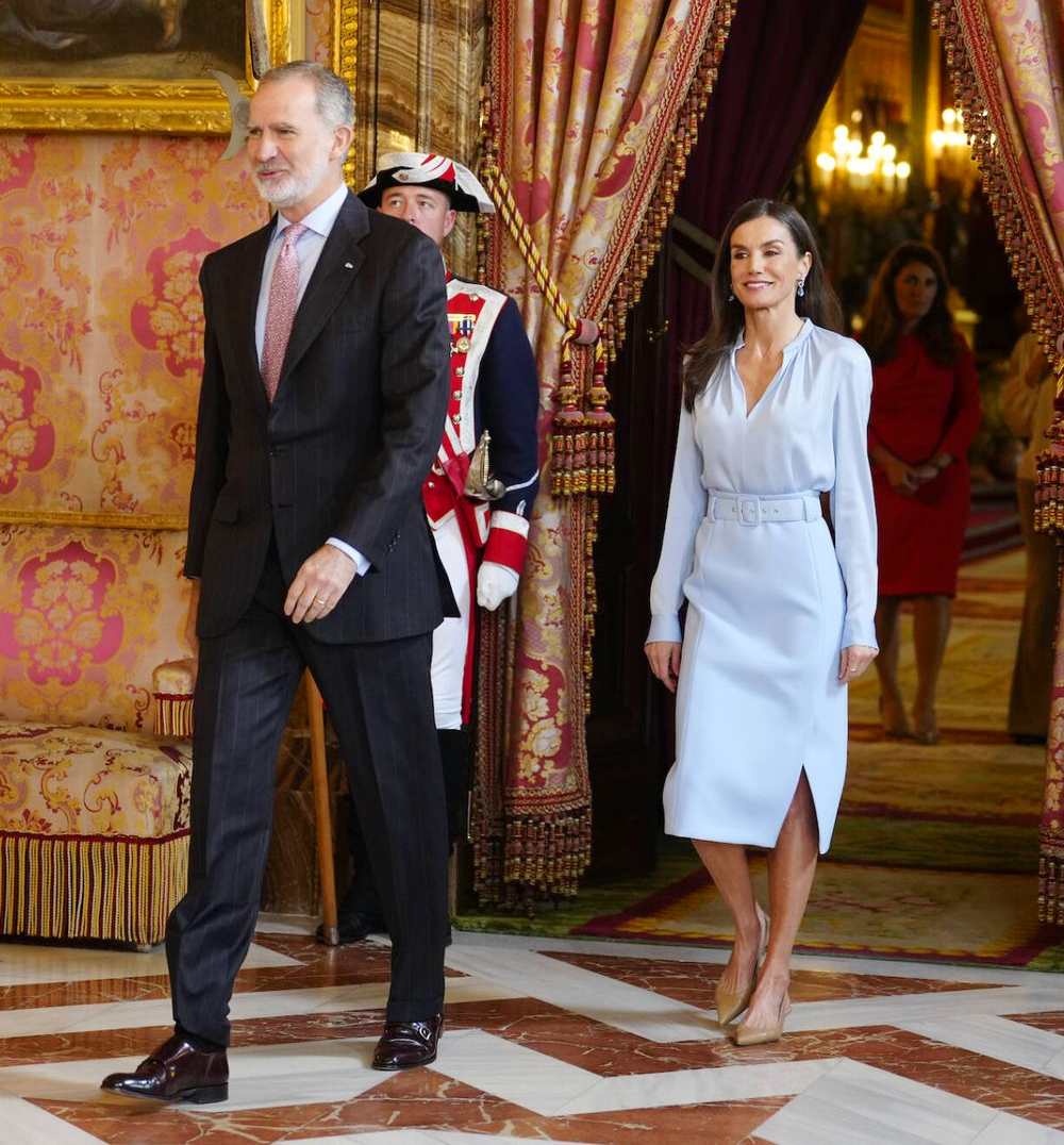 Queen Letizia Pairs a Hugo Boss Pencil Skirt with a Luxe Silk Blouse for Her Latest Outing The King and Queen at the Royal Palace to host the luncheon.