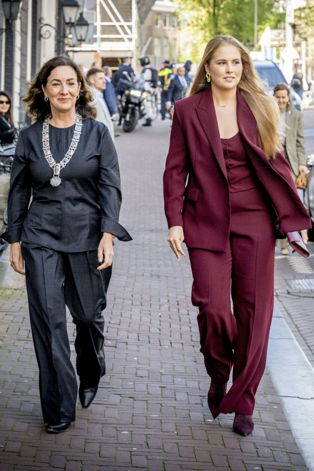 Princess Amalia Returns to Amsterdam in a Recycled Mango Suit Princess Amalia with the mayor of Amsterdam