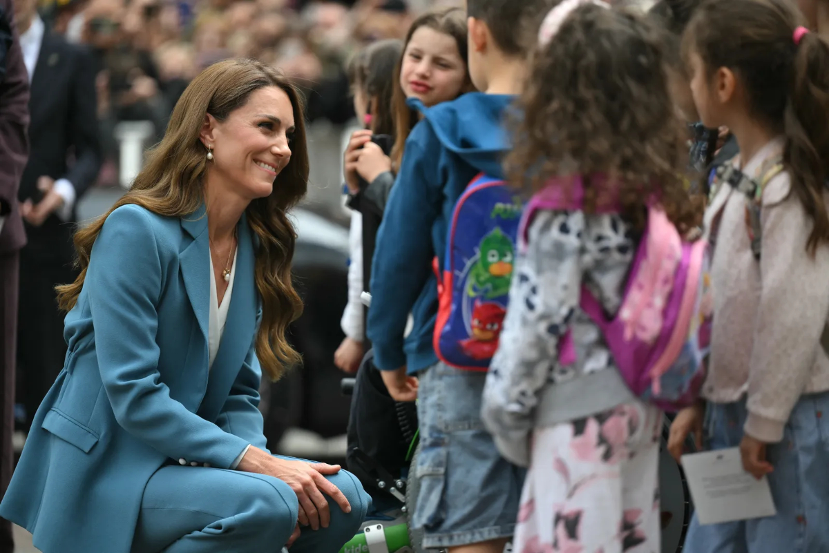 The Story Behind the Trip: Why Kate Middleton Visited Reggio Emilia Preschools in Italy Kate chats with some children upon her arrival at Reggio Emilia City Hall