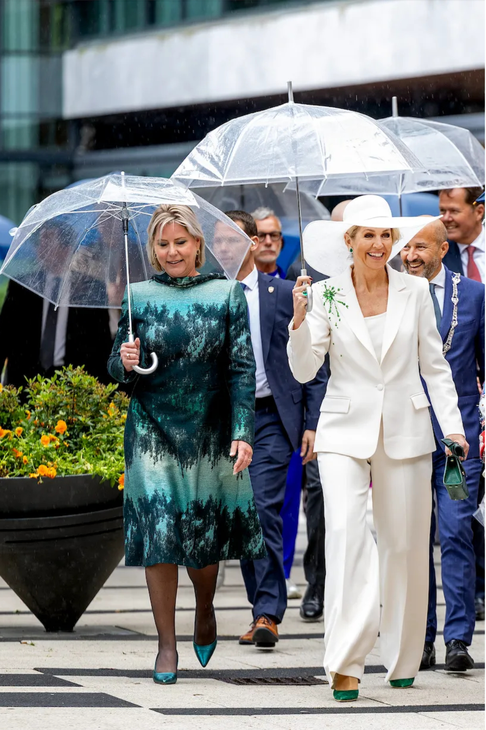 Queen Maxima Wears a White Claes Iversen Suit With Green Sequins in the Rain at State of Fashion Queen Maxima's Style at the State of Fashion in Arnhem