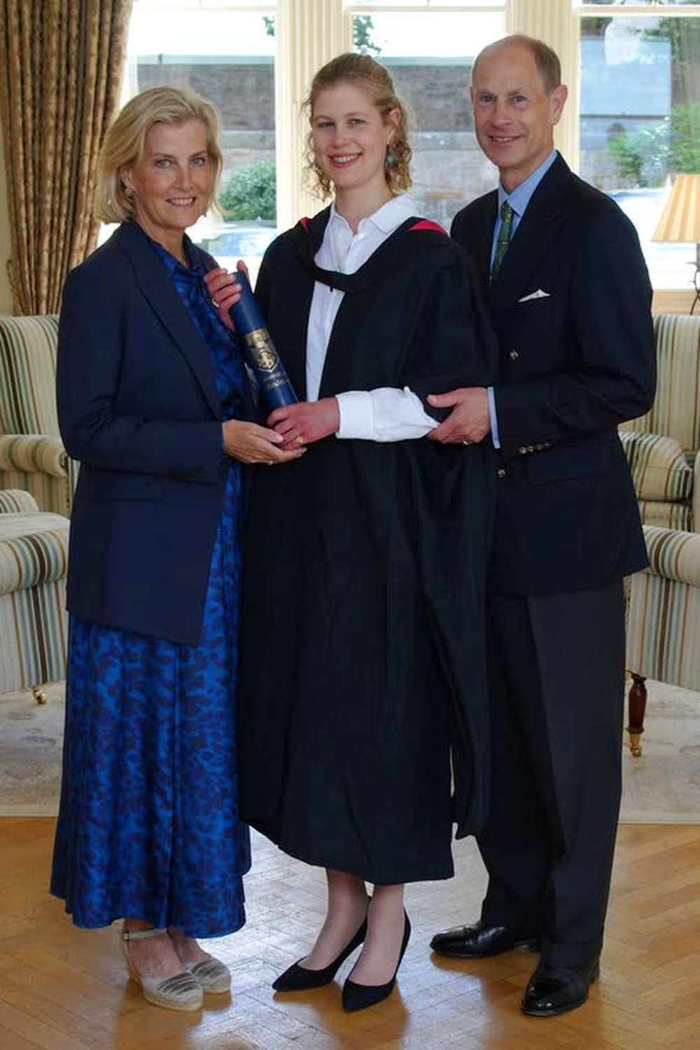 Why did Lady Louise Receive the Duke of Edinburgh's Gold Award? Lady Louise with the Dukes of Edinburgh at her graduation.